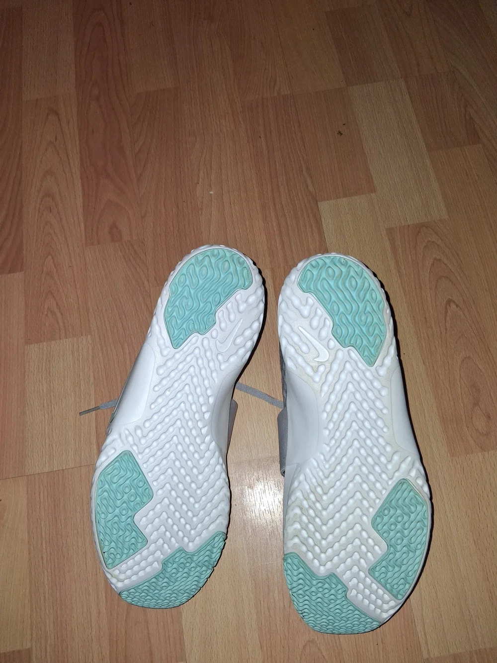 Nike Women's Light Gray Sneakers with Mint Accents